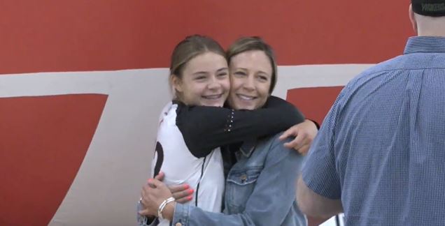 Girl and mom hugging