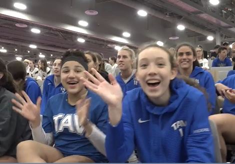 Athletes from TAV waving at the camera