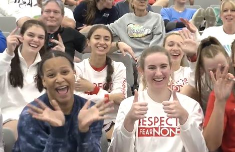 Girls waving at camera