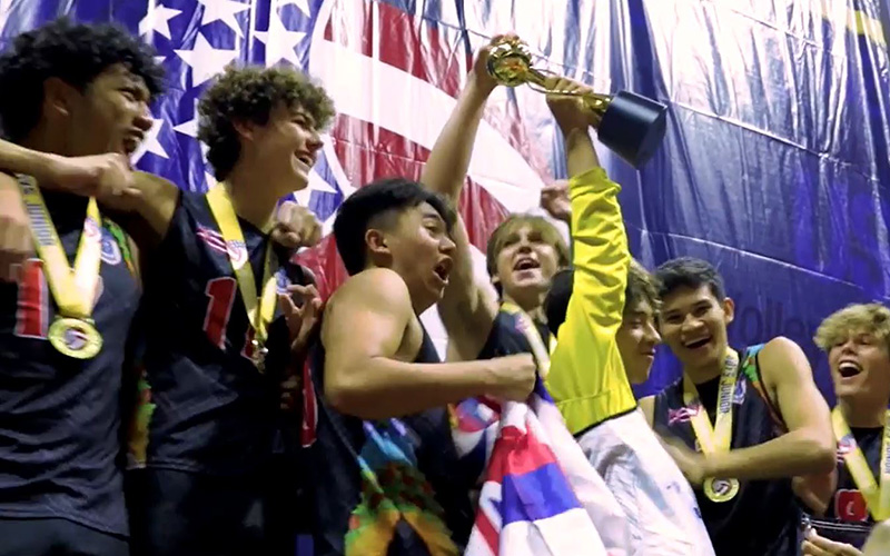 Boys holding up a trophy