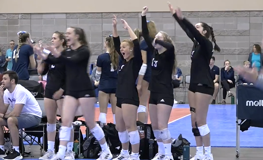 Girls cheering on their team