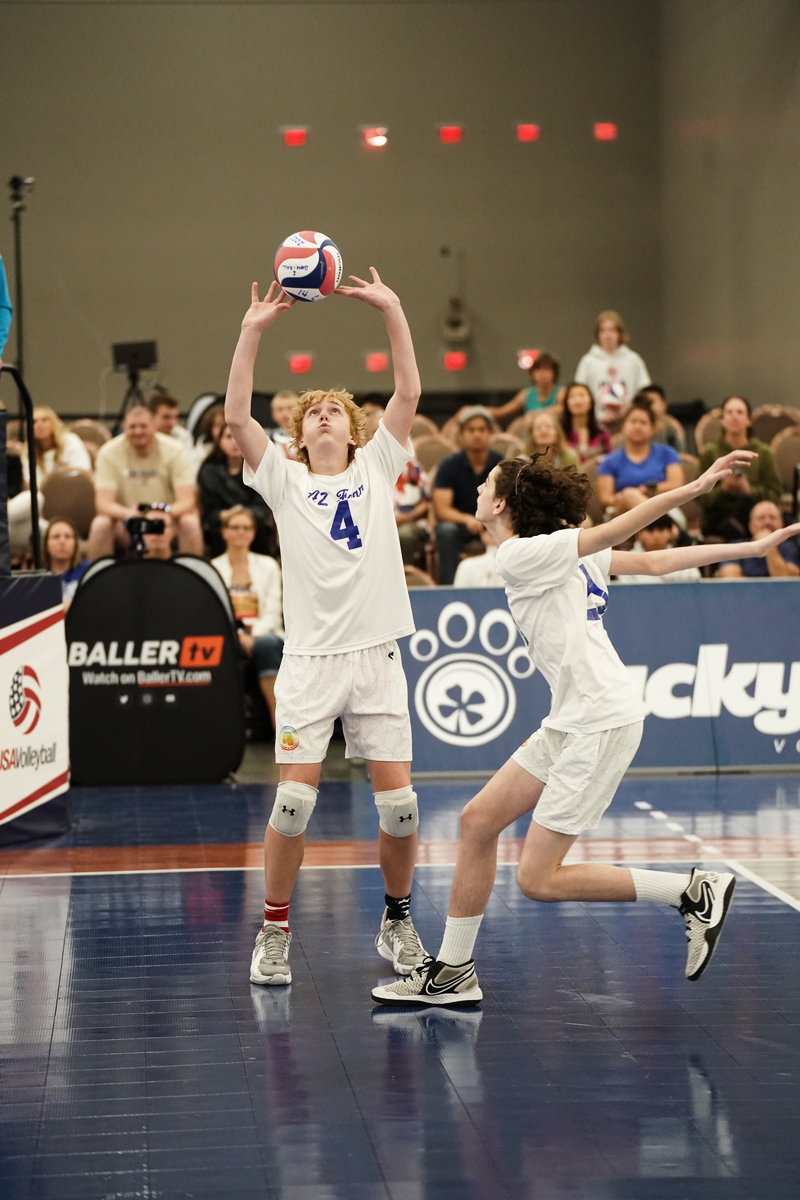 boy setting with a hitter ready to jump