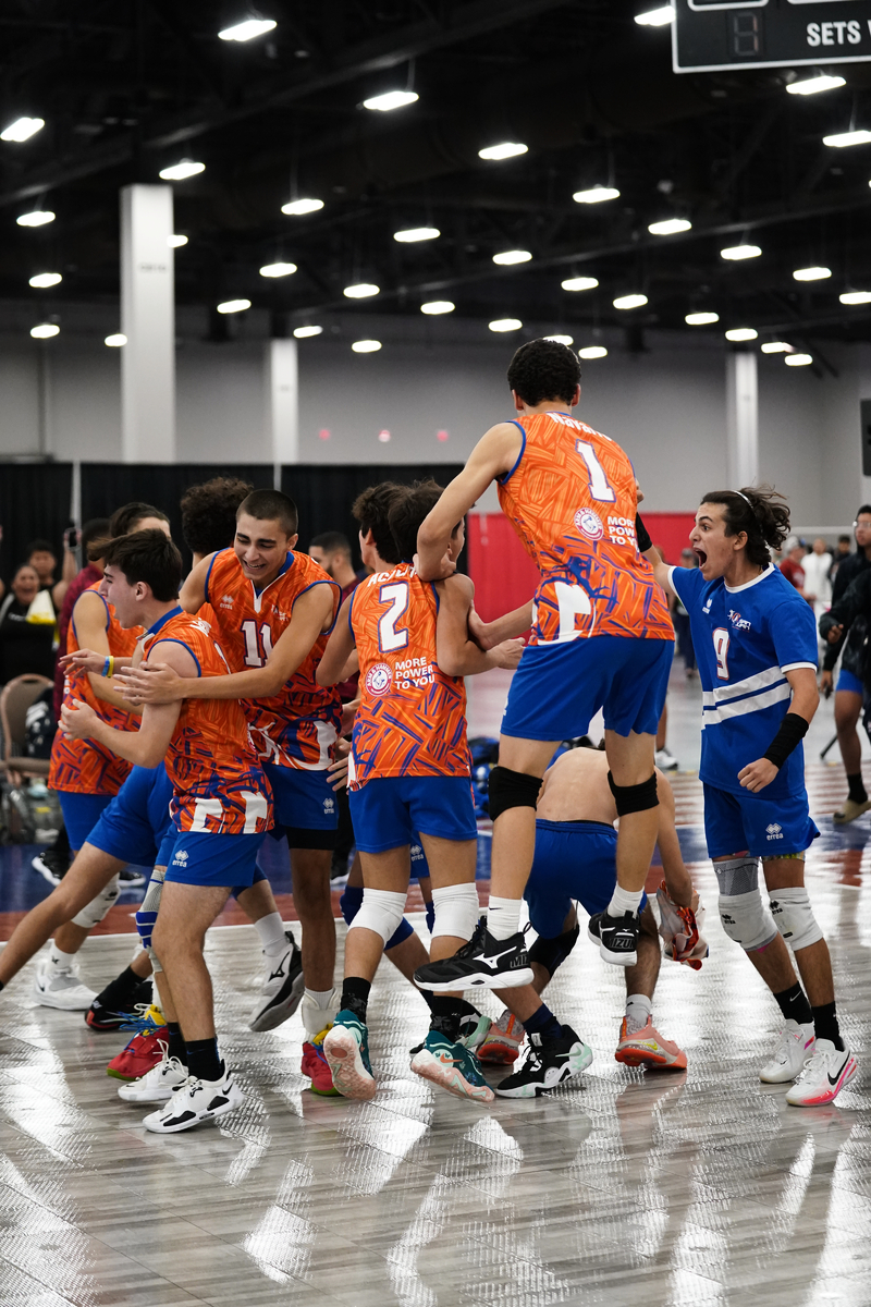 boys celebrating on court