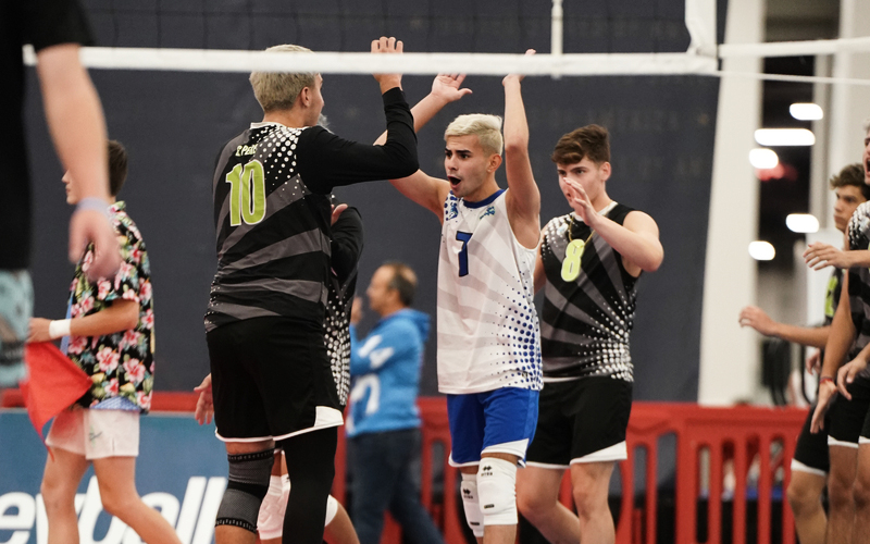 boys team celebrating on court